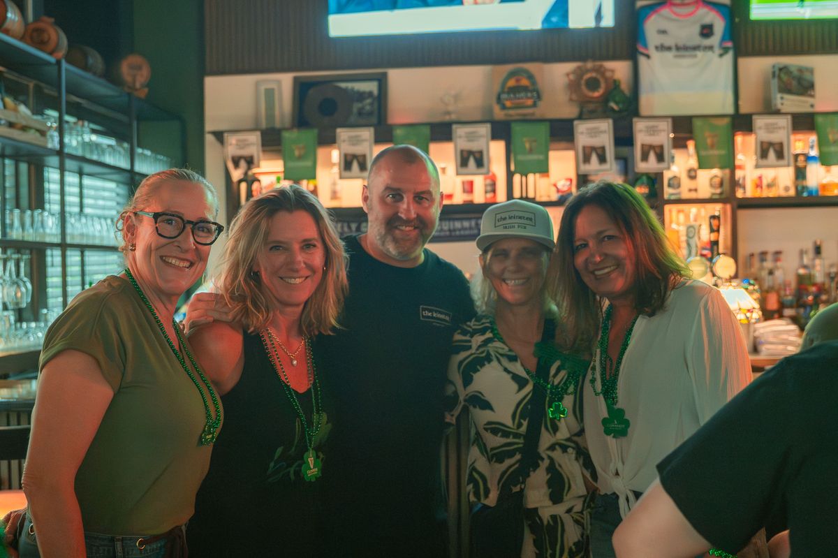 Group of friends posing at The Leinster Irish Pub St. Patrick's Day party